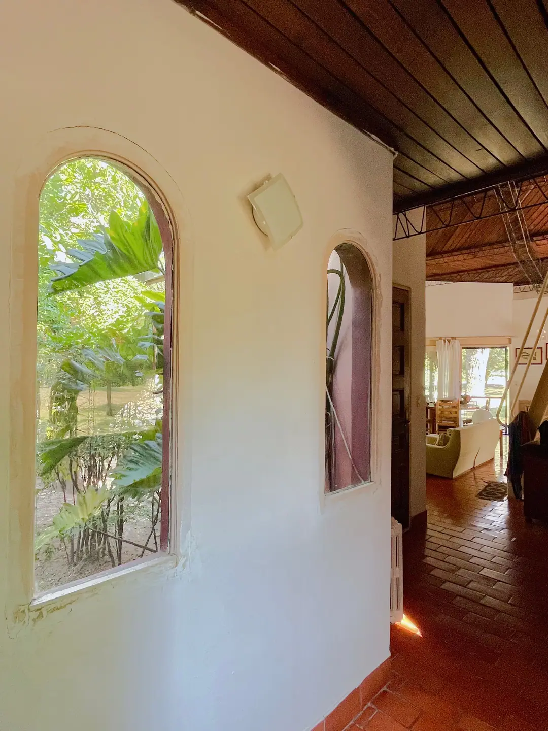 Arched windows along an interior passage