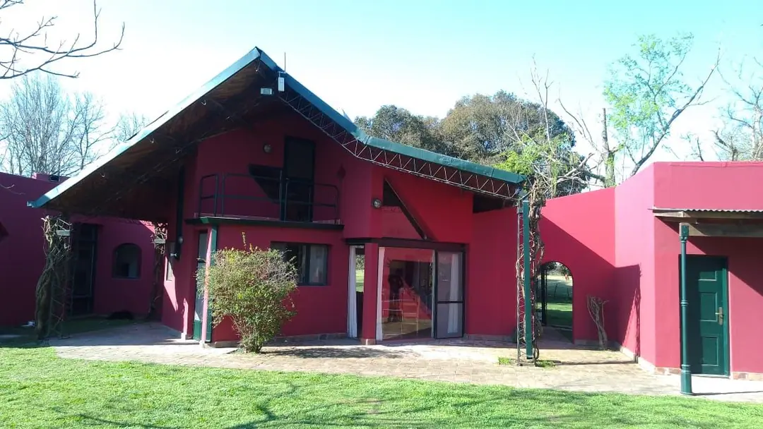 West side of the house with its steel-truss roof