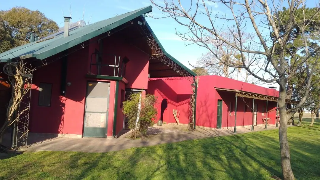 West side of the house with its steel-truss roof