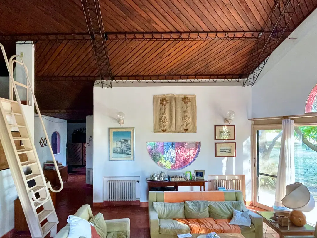 The living room with its ladder to the mezzanine studio