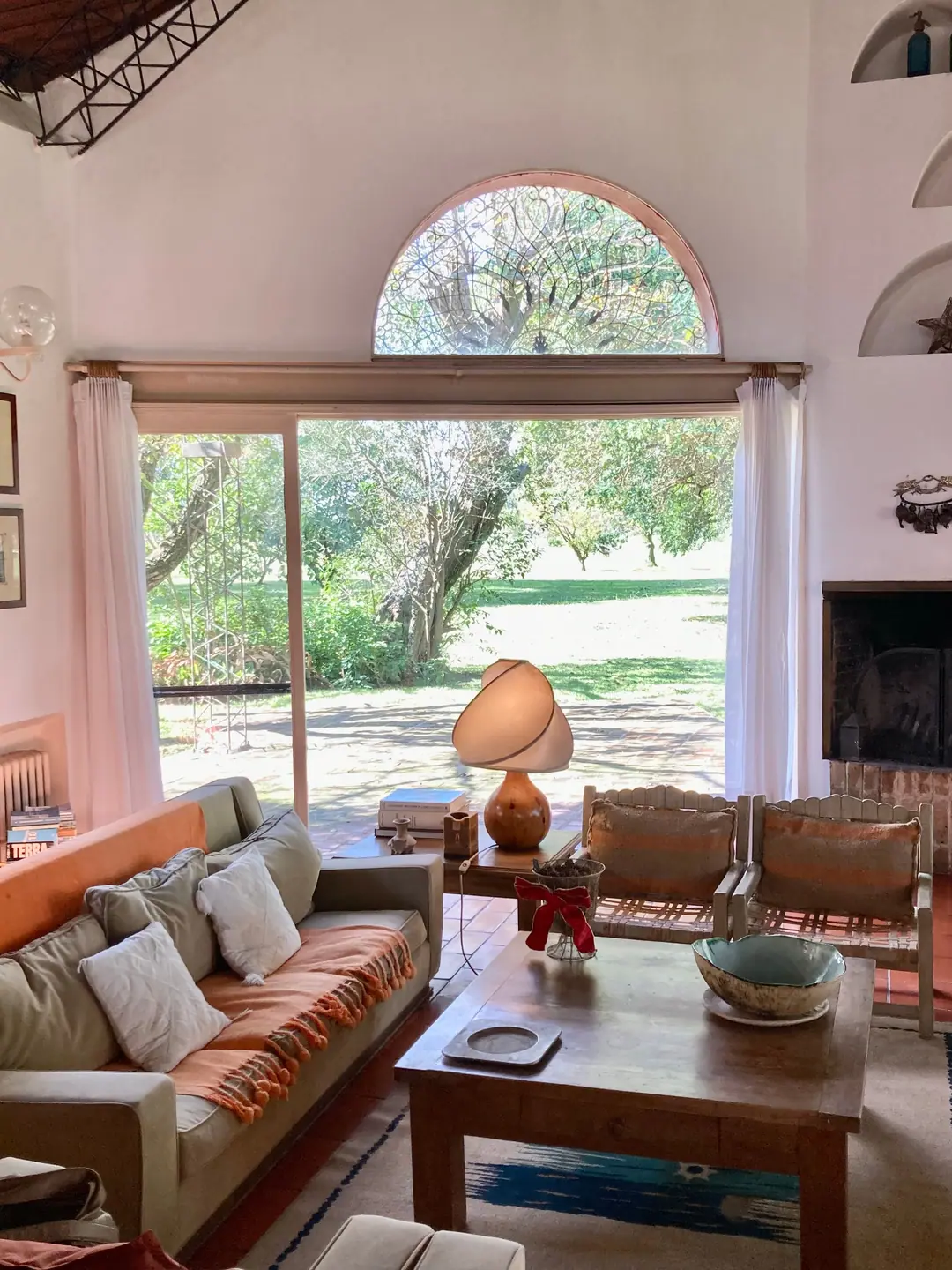 Sofas facing the park through the arched window
